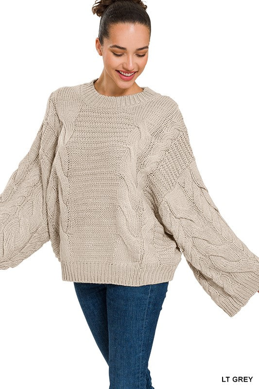 OVERSIZED BELL SLEEVE CABLE KNIT SWEATER